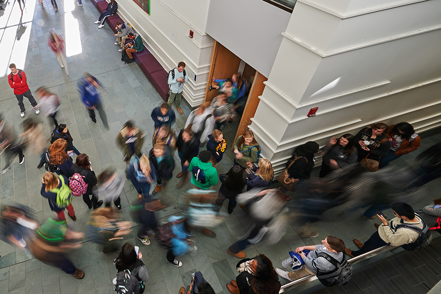 A blur of students walking to and from class inside Laurel Hall.